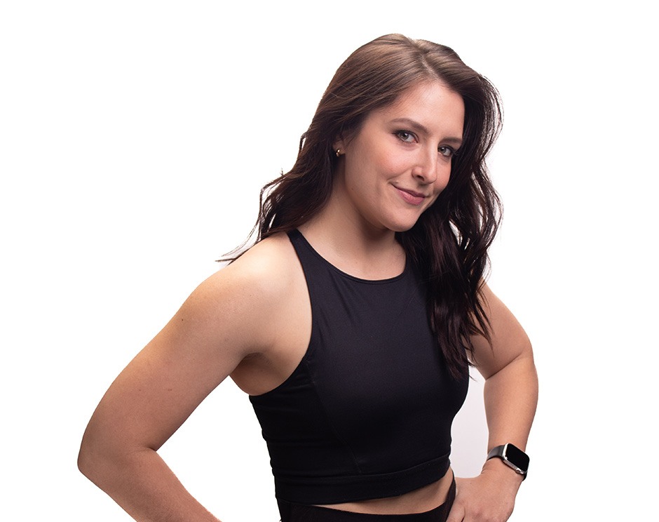 Barry's instructor standing confidently wearing a black top against a white background.