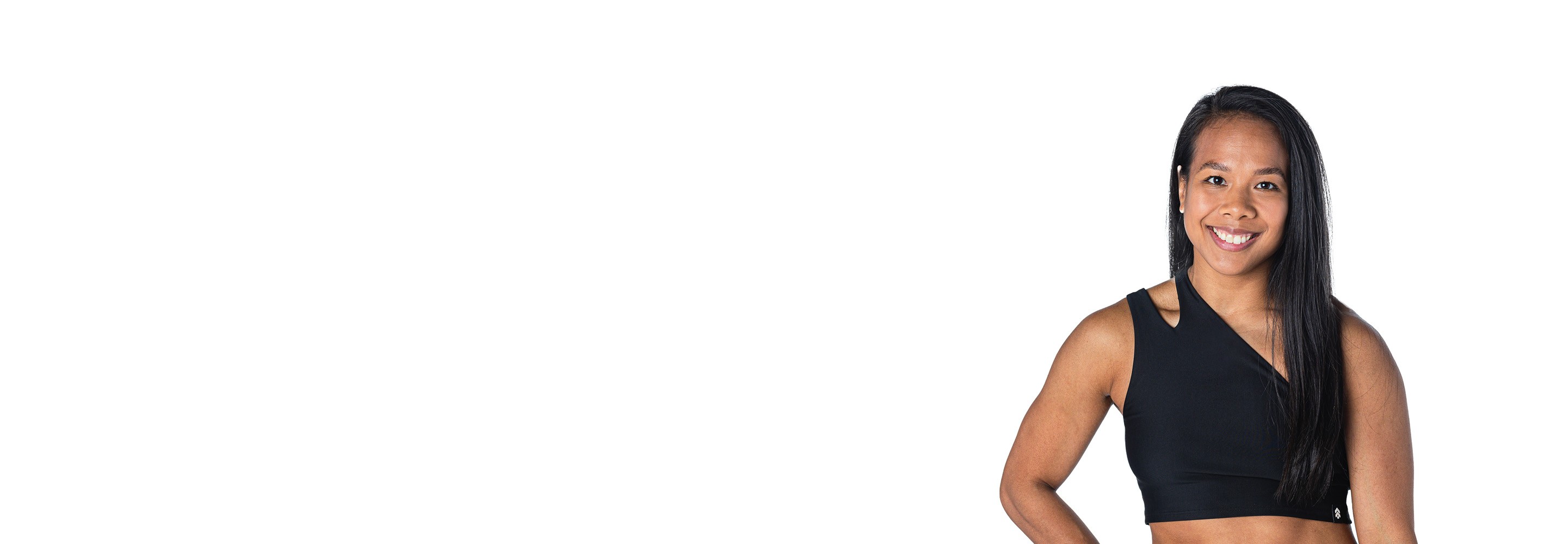 Barry's instructor standing confidently wearing a black top against a white background.