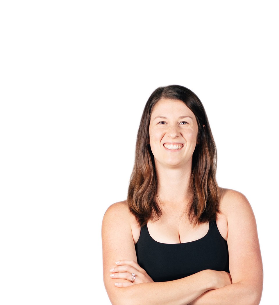 Barry's instructor standing confidently wearing a black top against a white background.