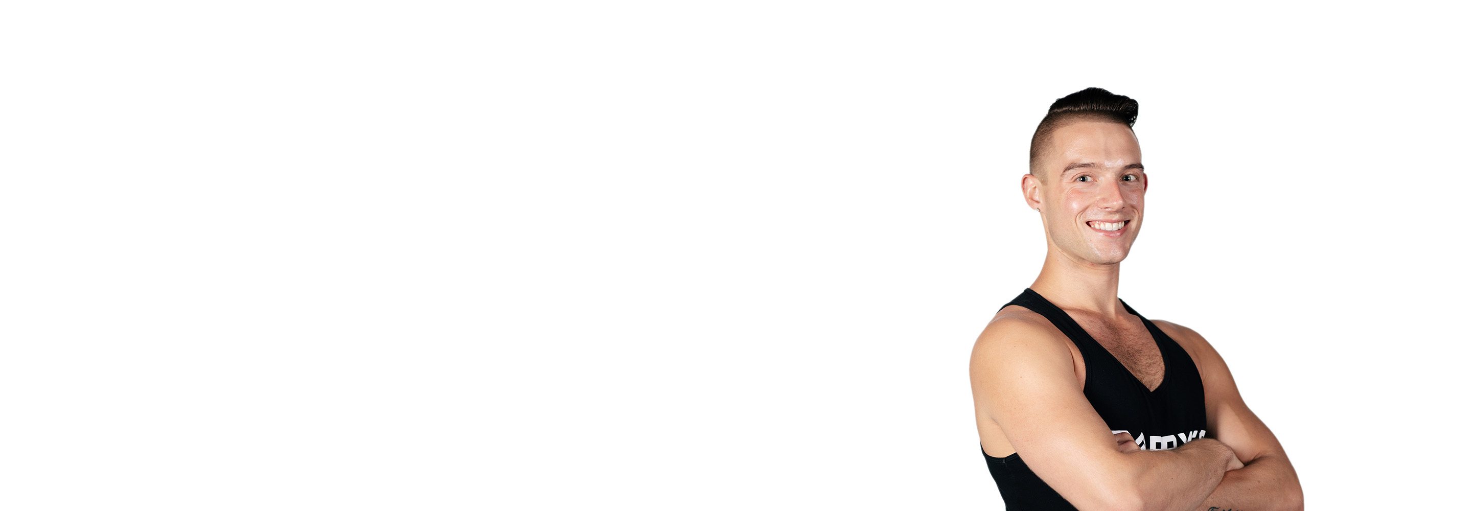 Barry's instructor standing confidently wearing a black top against a white background.