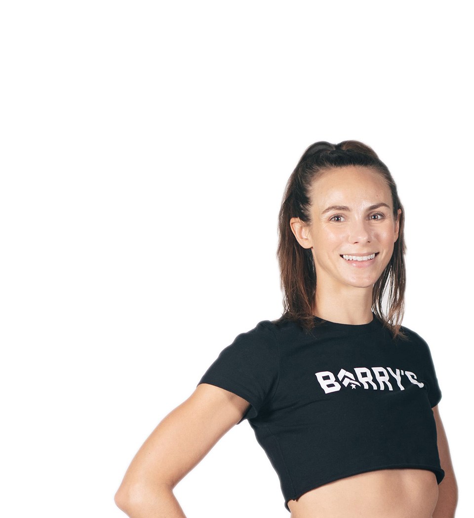 Barry's instructor standing confidently wearing a black top against a white background.