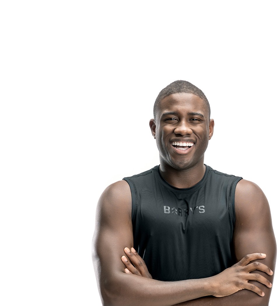 Barry's instructor standing confidently wearing a black top against a white background.