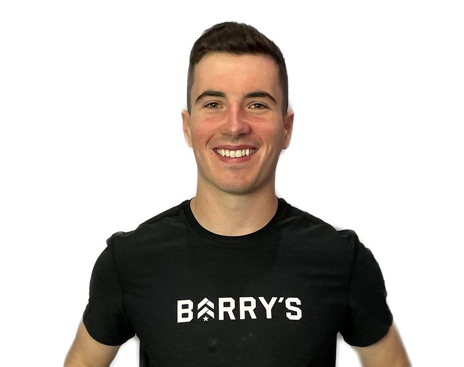 Barry's instructor standing confidently wearing a black top against a white background.