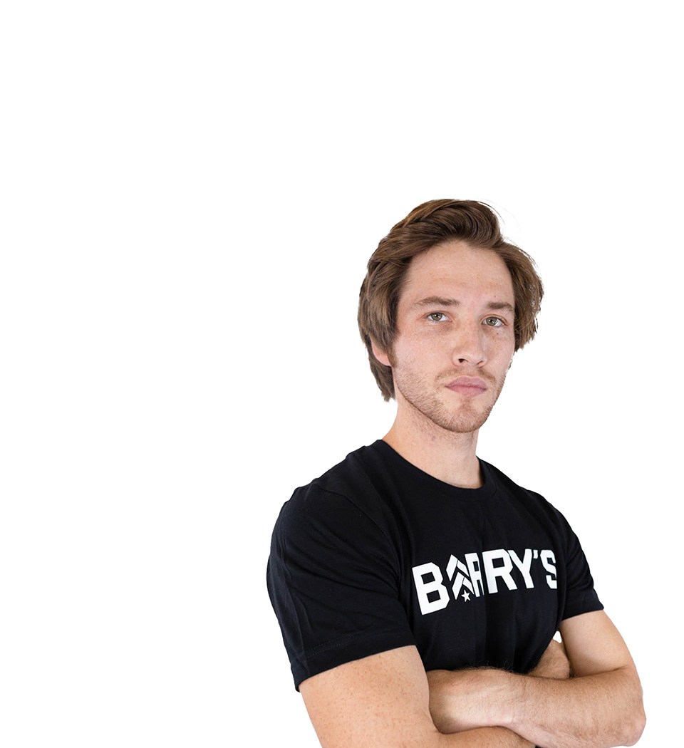 Barry's instructor standing confidently wearing a black top against a white background.