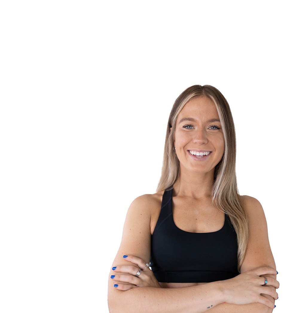 Barry's instructor standing confidently wearing a black top against a white background.