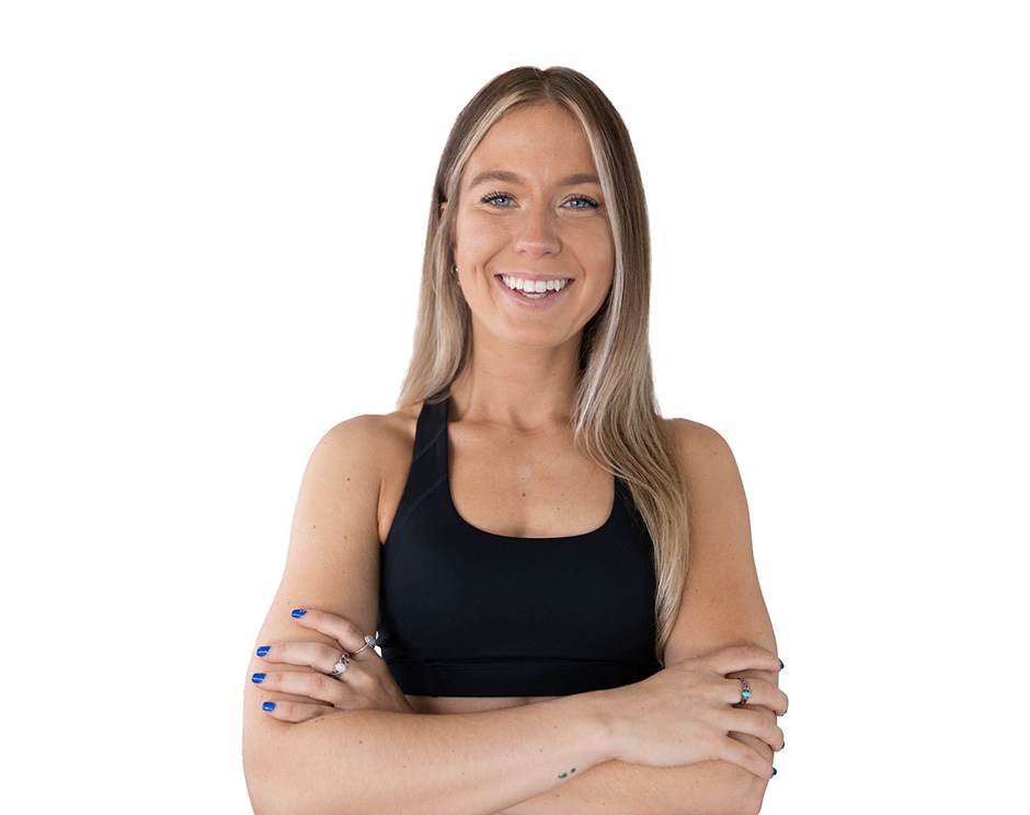 Barry's instructor standing confidently wearing a black top against a white background.
