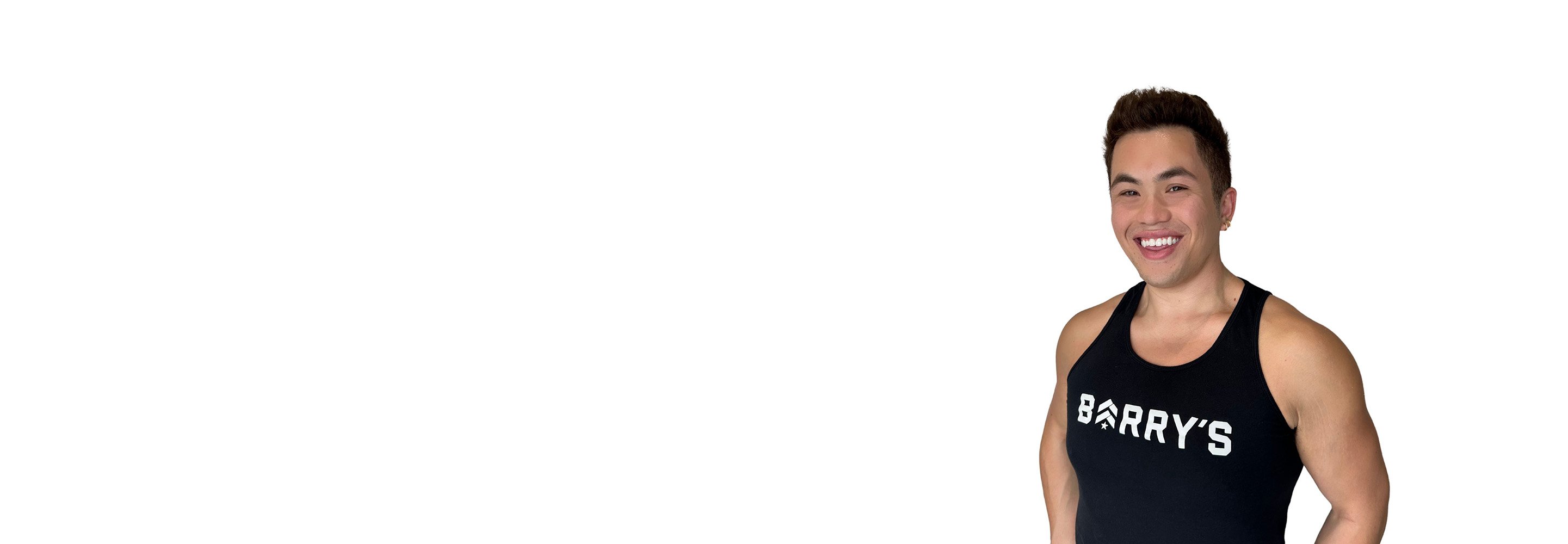 Barry's instructor standing confidently wearing a black top against a white background.