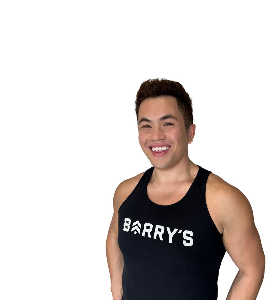 Barry's instructor standing confidently wearing a black top against a white background.
