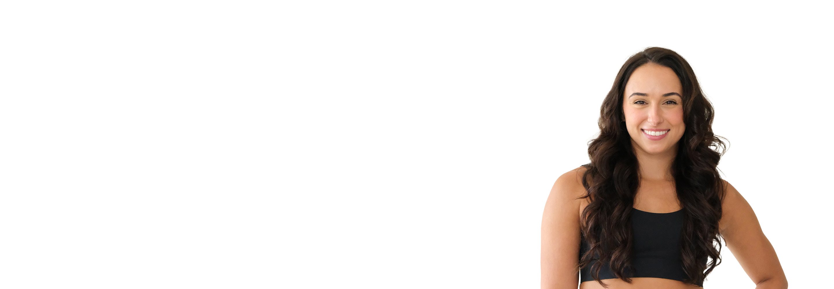 Barry's instructor standing confidently wearing a black top against a white background.