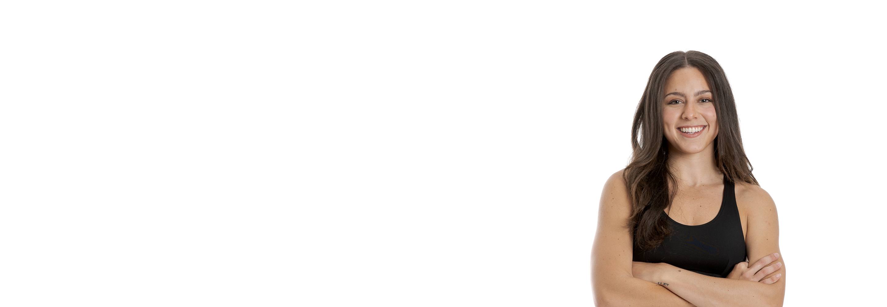 Barry's instructor standing confidently wearing a black top against a white background.