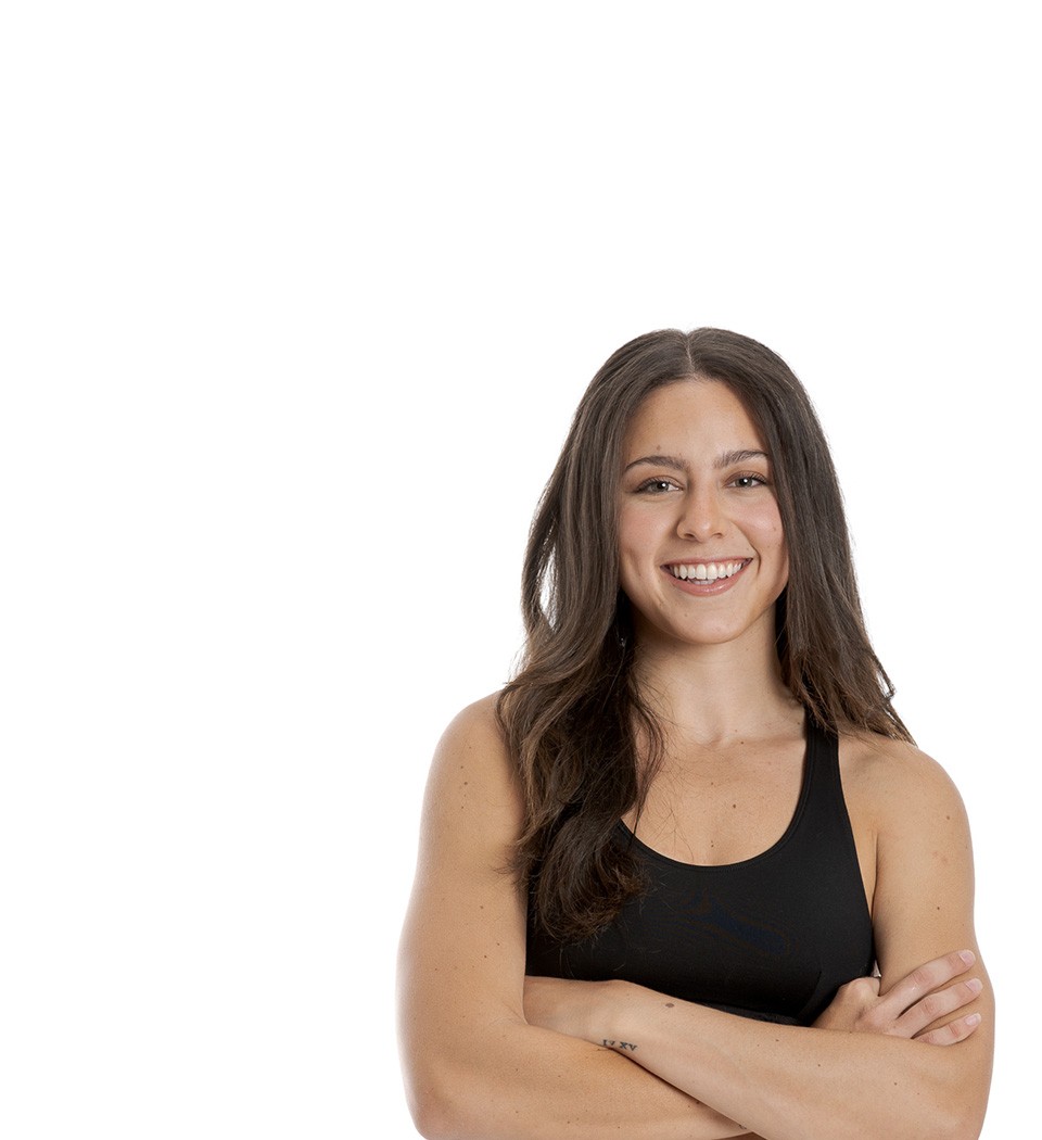Barry's instructor standing confidently wearing a black top against a white background.