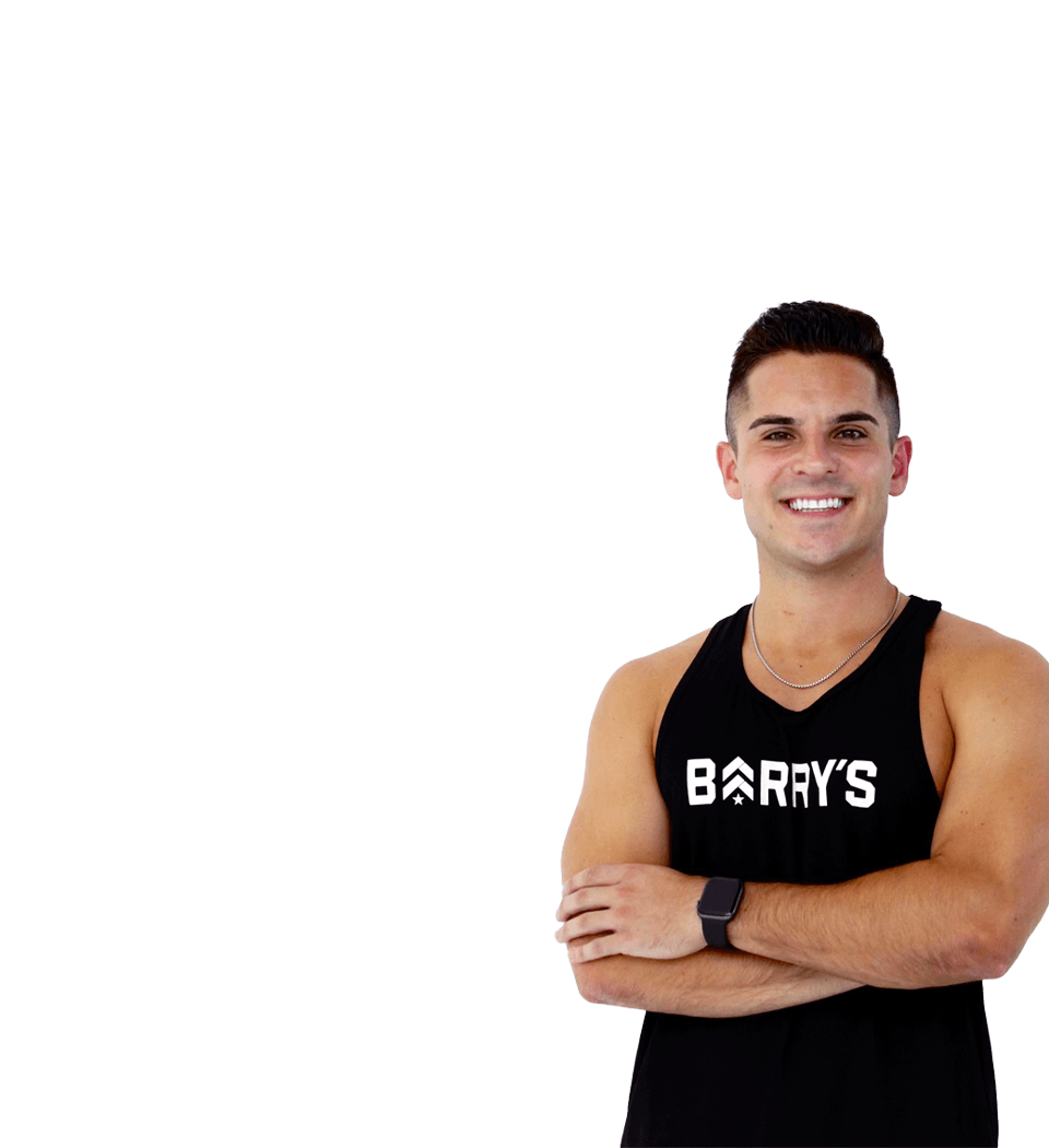 Barry's instructor standing confidently wearing a black top against a white background.