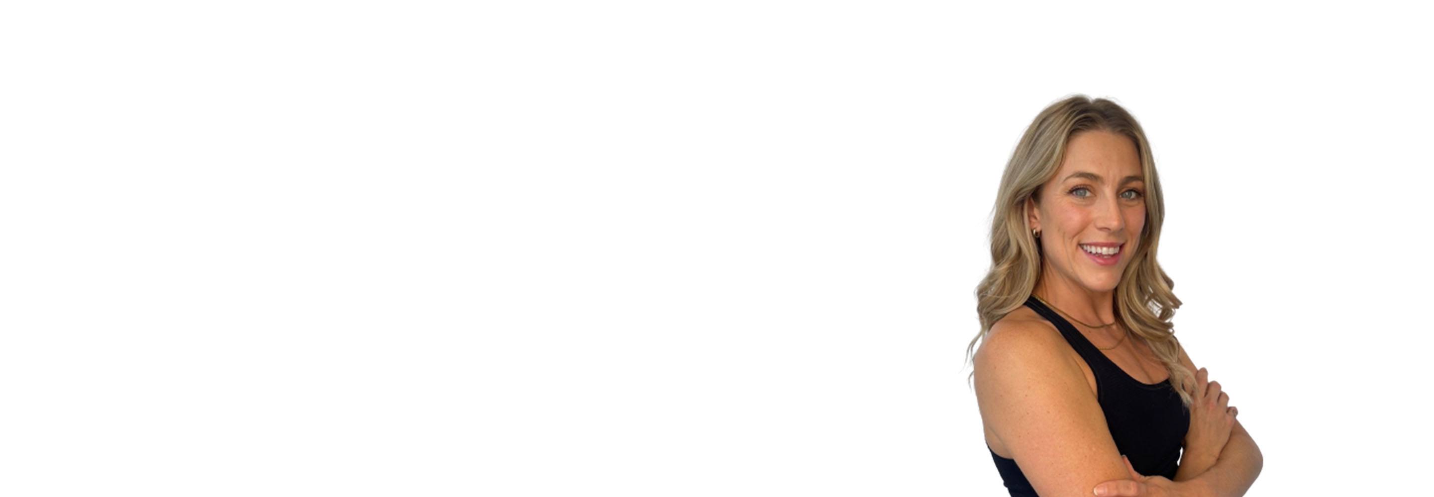 Barry's instructor standing confidently wearing a black top against a white background.