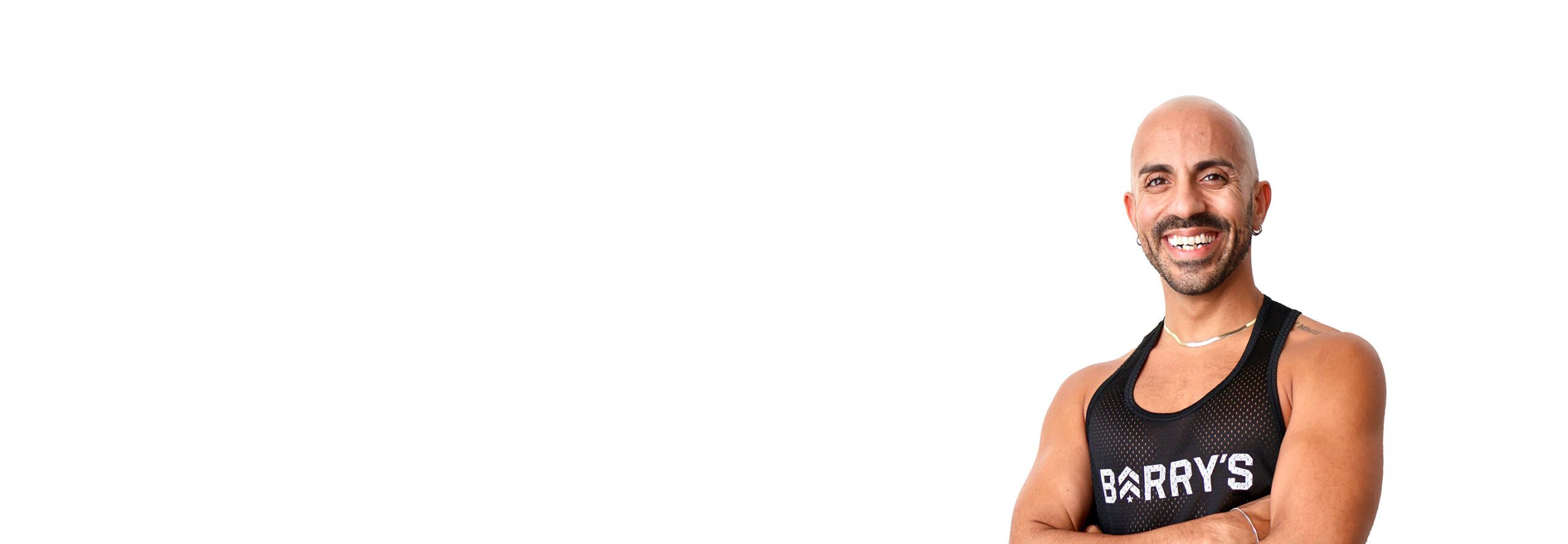 Barry's instructor standing confidently wearing a black top against a white background.