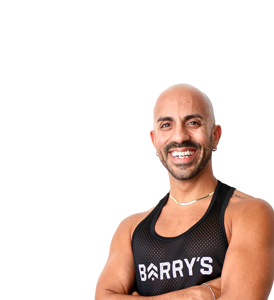 Barry's instructor standing confidently wearing a black top against a white background.