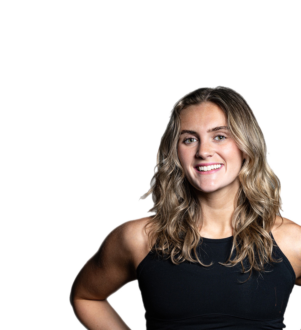 Barry's instructor standing confidently wearing a black top against a white background.