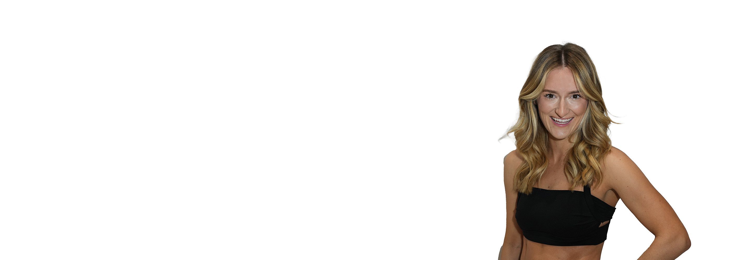 Barry's instructor standing confidently wearing a black top against a white background.