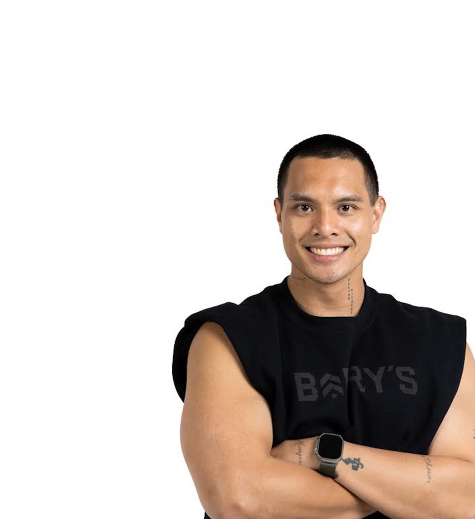 Barry's instructor standing confidently wearing a black top against a white background.