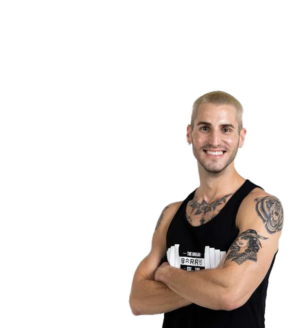 Barry's instructor standing confidently wearing a black top against a white background.