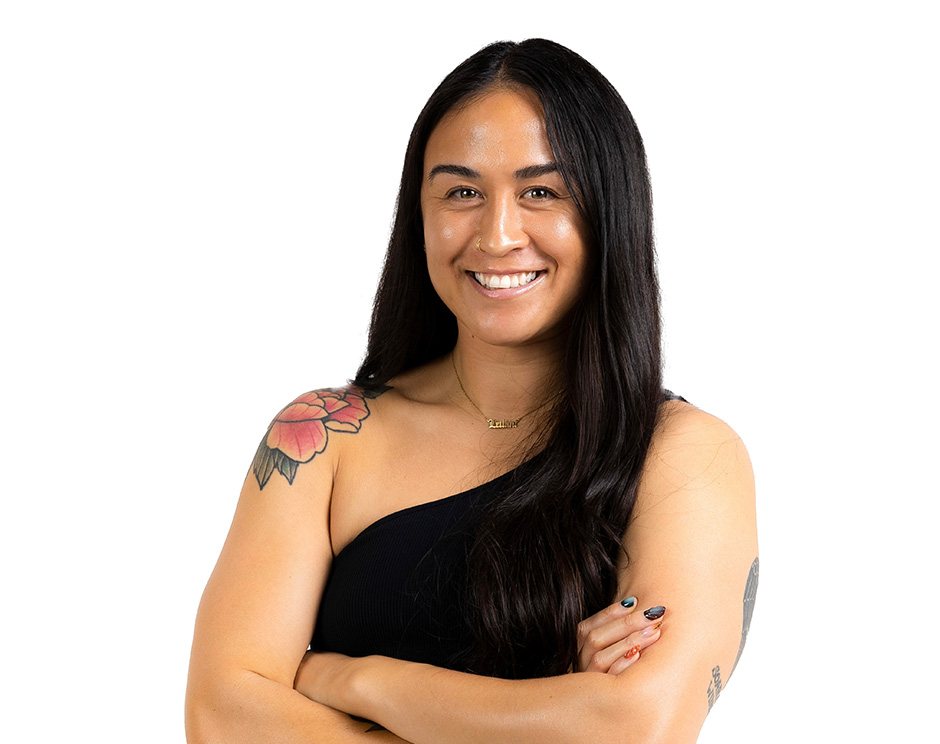 Barry's instructor standing confidently wearing a black top against a white background.