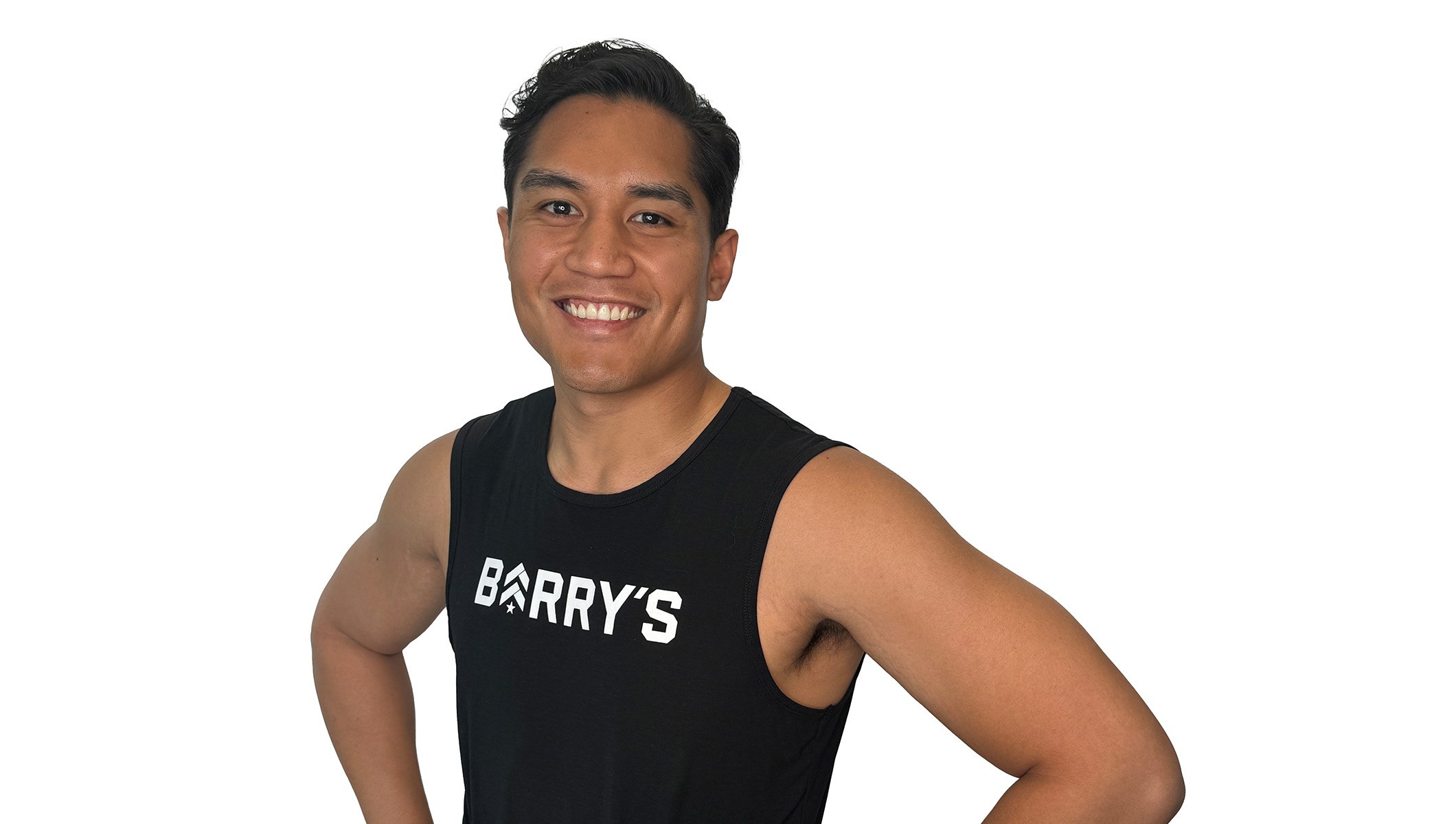 Barry's instructor standing confidently wearing a black top against a white background.