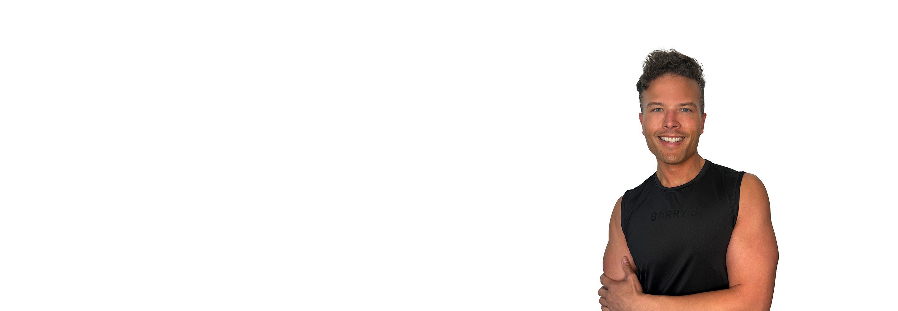 Barry's instructor standing confidently wearing a black top against a white background.