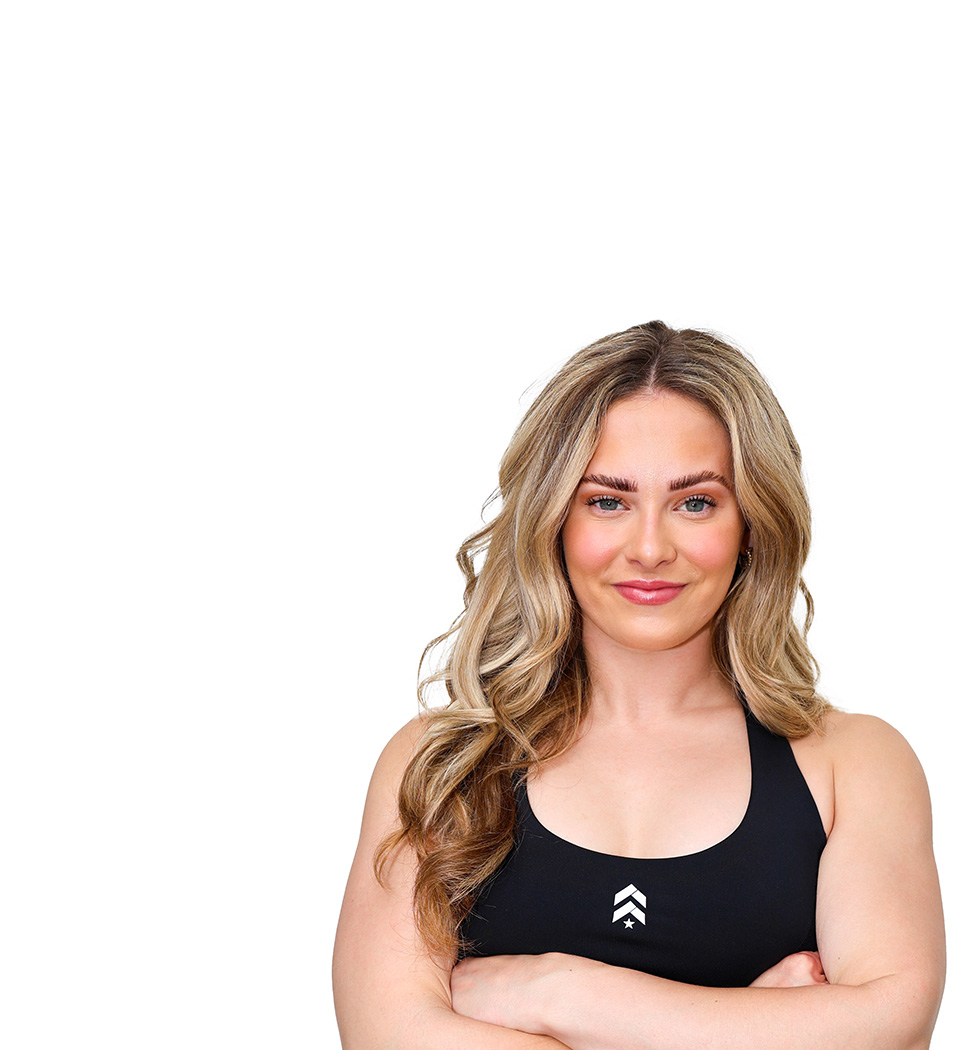 Barry's instructor standing confidently wearing a black top against a white background.