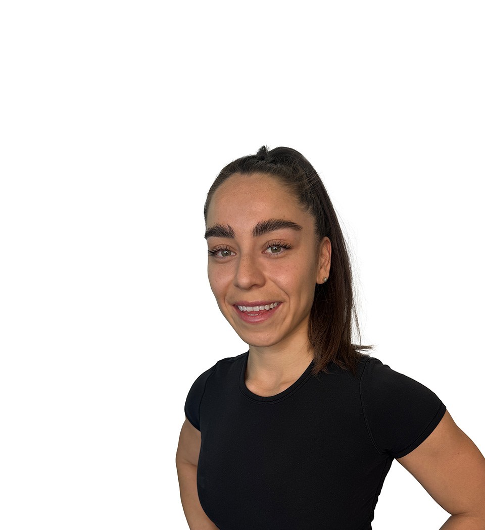 Barry's instructor standing confidently wearing a black top against a white background.