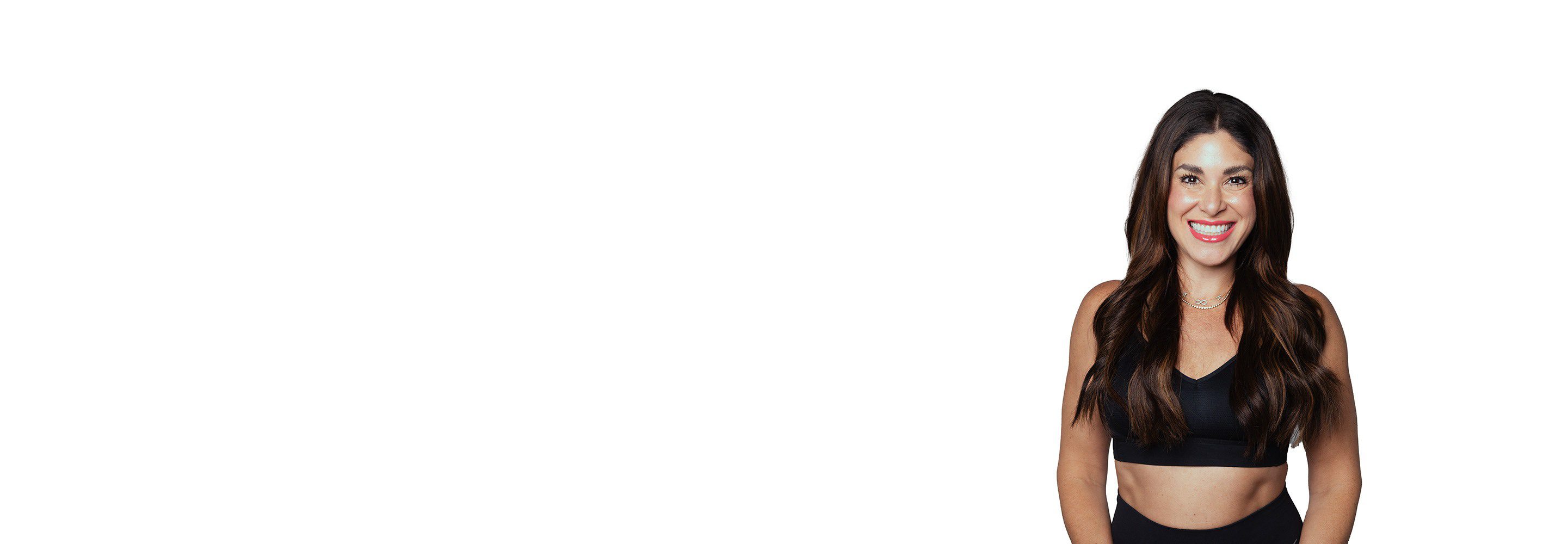 Barry's instructor standing confidently wearing a black top against a white background.