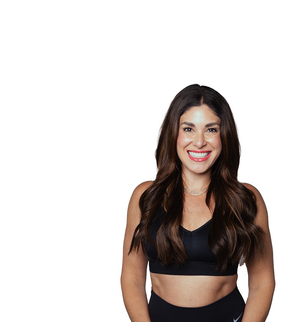 Barry's instructor standing confidently wearing a black top against a white background.