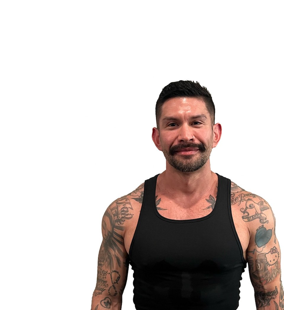 Barry's instructor standing confidently wearing a black top against a white background.