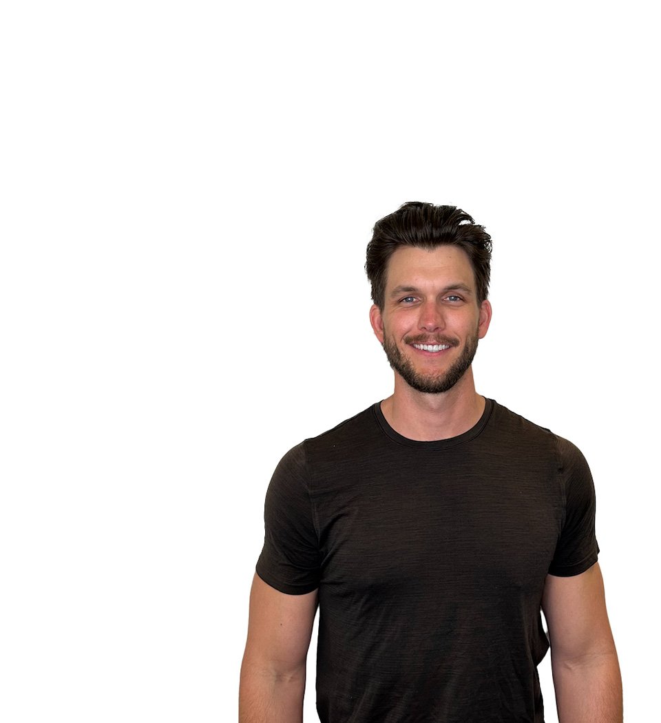 Barry's instructor standing confidently wearing a black top against a white background.