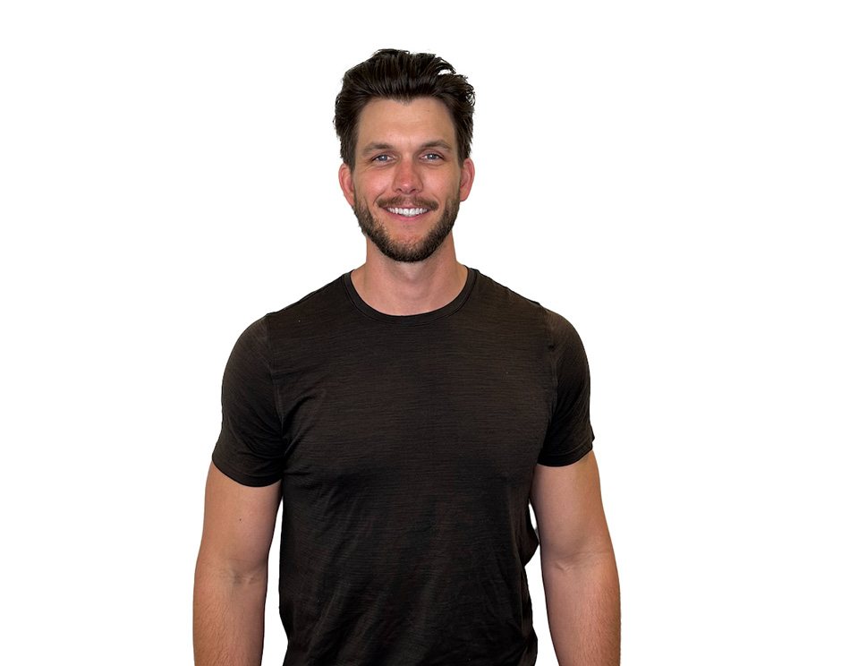 Barry's instructor standing confidently wearing a black top against a white background.