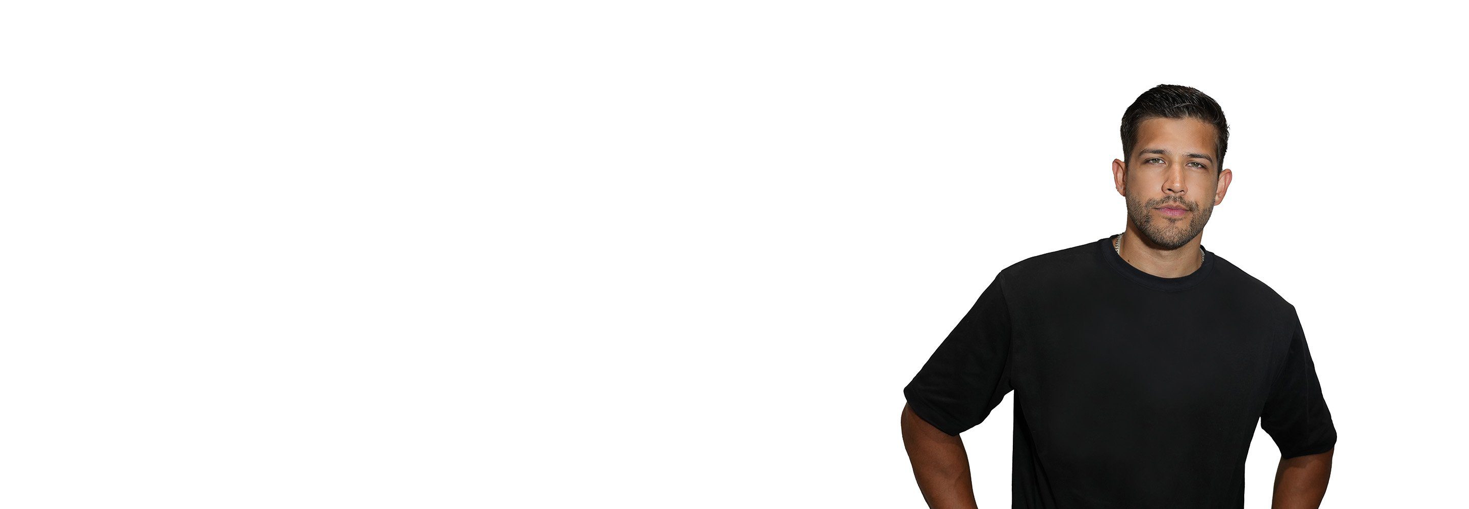 Barry's instructor standing confidently wearing a black top against a white background.