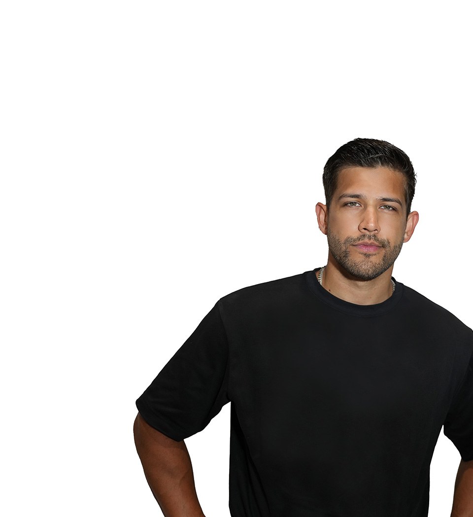 Barry's instructor standing confidently wearing a black top against a white background.