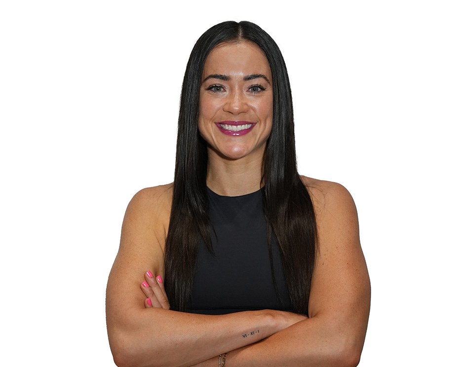 Barry's instructor standing confidently wearing a black top against a white background.