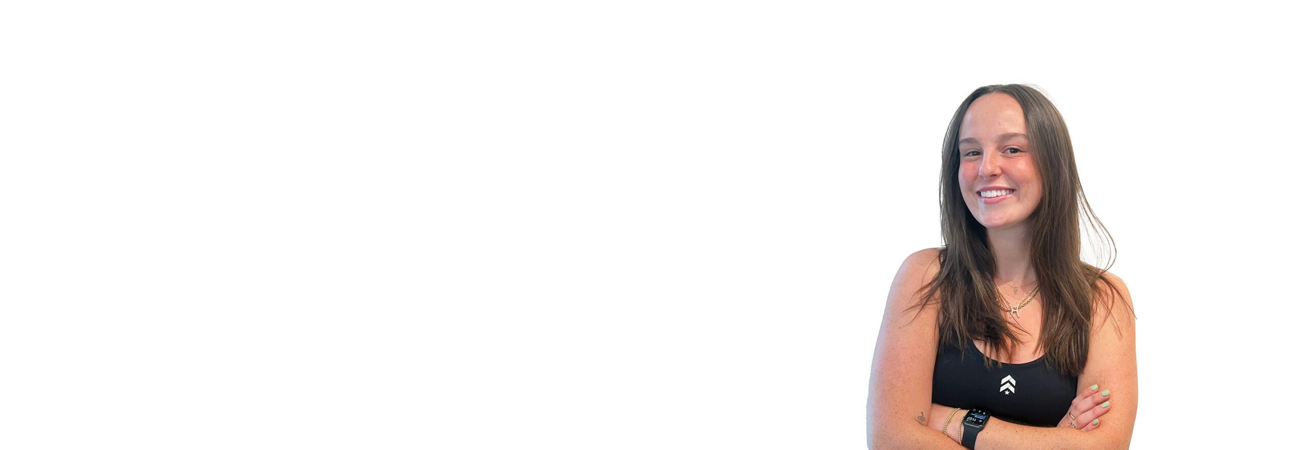 Barry's instructor standing confidently wearing a black top against a white background.