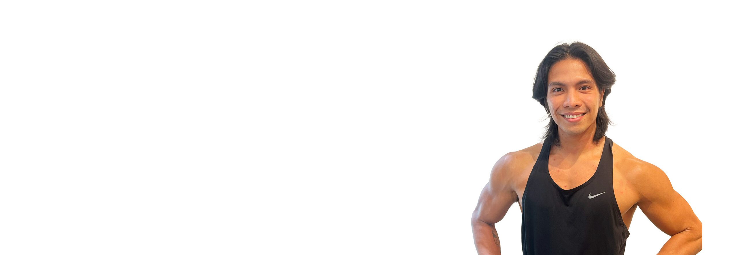 Barry's instructor standing confidently wearing a black top against a white background.