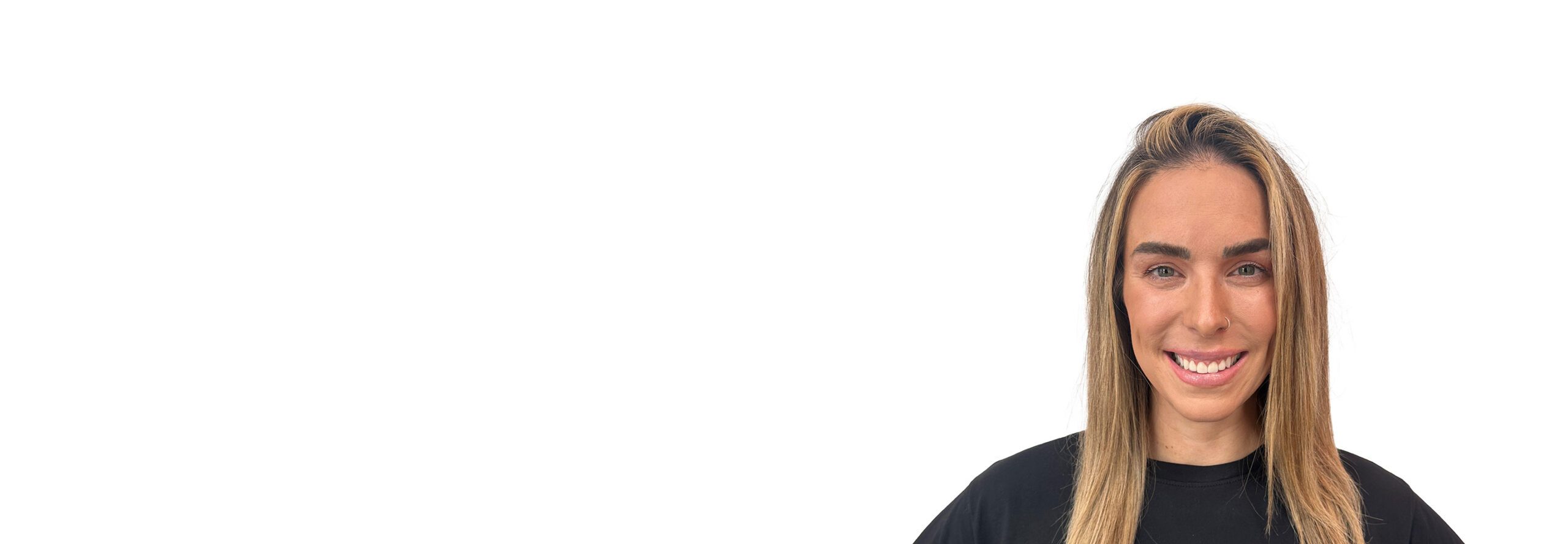 Barry's instructor standing confidently wearing a black top against a white background.