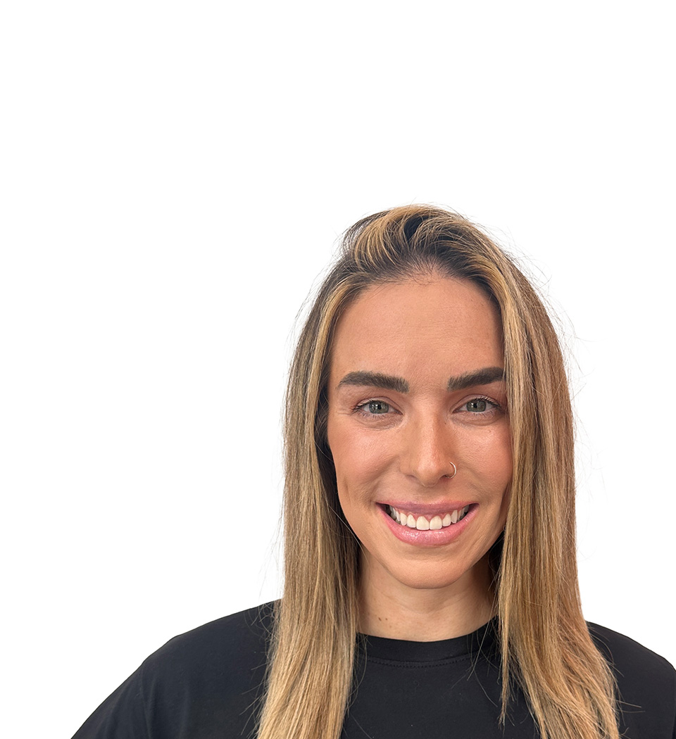 Barry's instructor standing confidently wearing a black top against a white background.