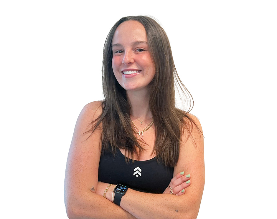 Barry's instructor standing confidently wearing a black top against a white background.