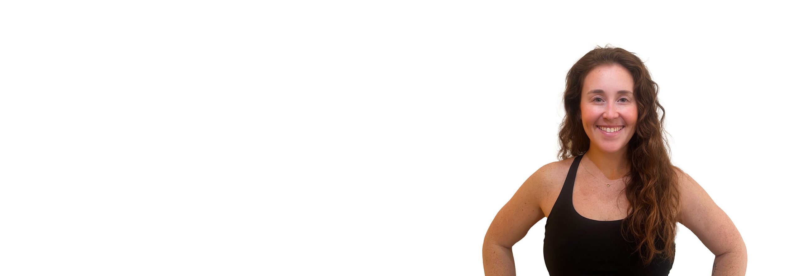 Maddy B. Barry's instructor standing confidently wearing a black top against a white background.