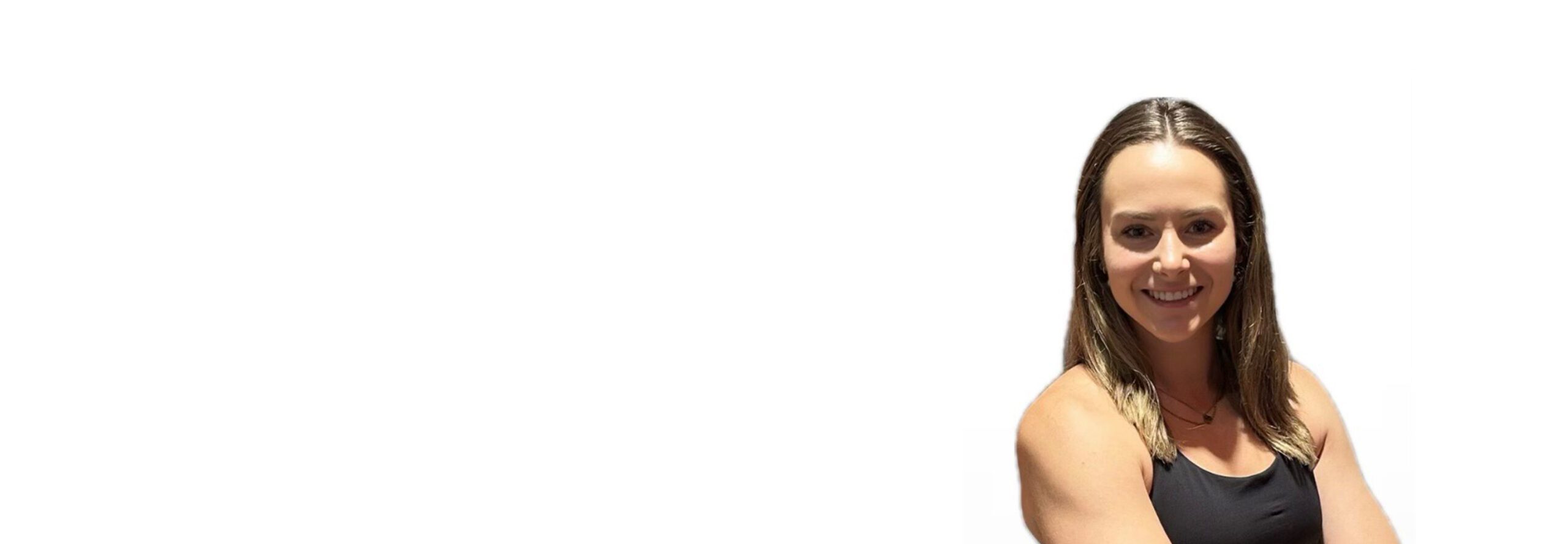 Barry's instructor standing confidently wearing a black top against a white background.