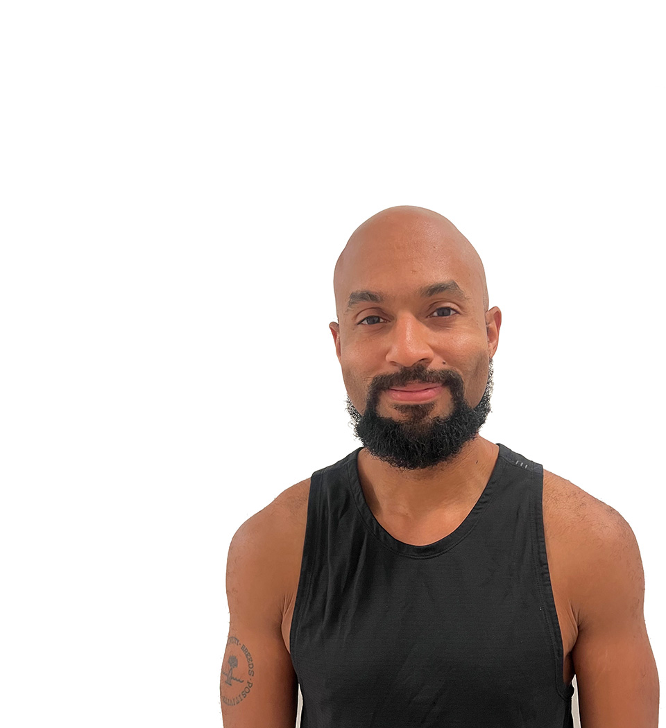 Barry's instructor standing confidently wearing a black top against a white background.