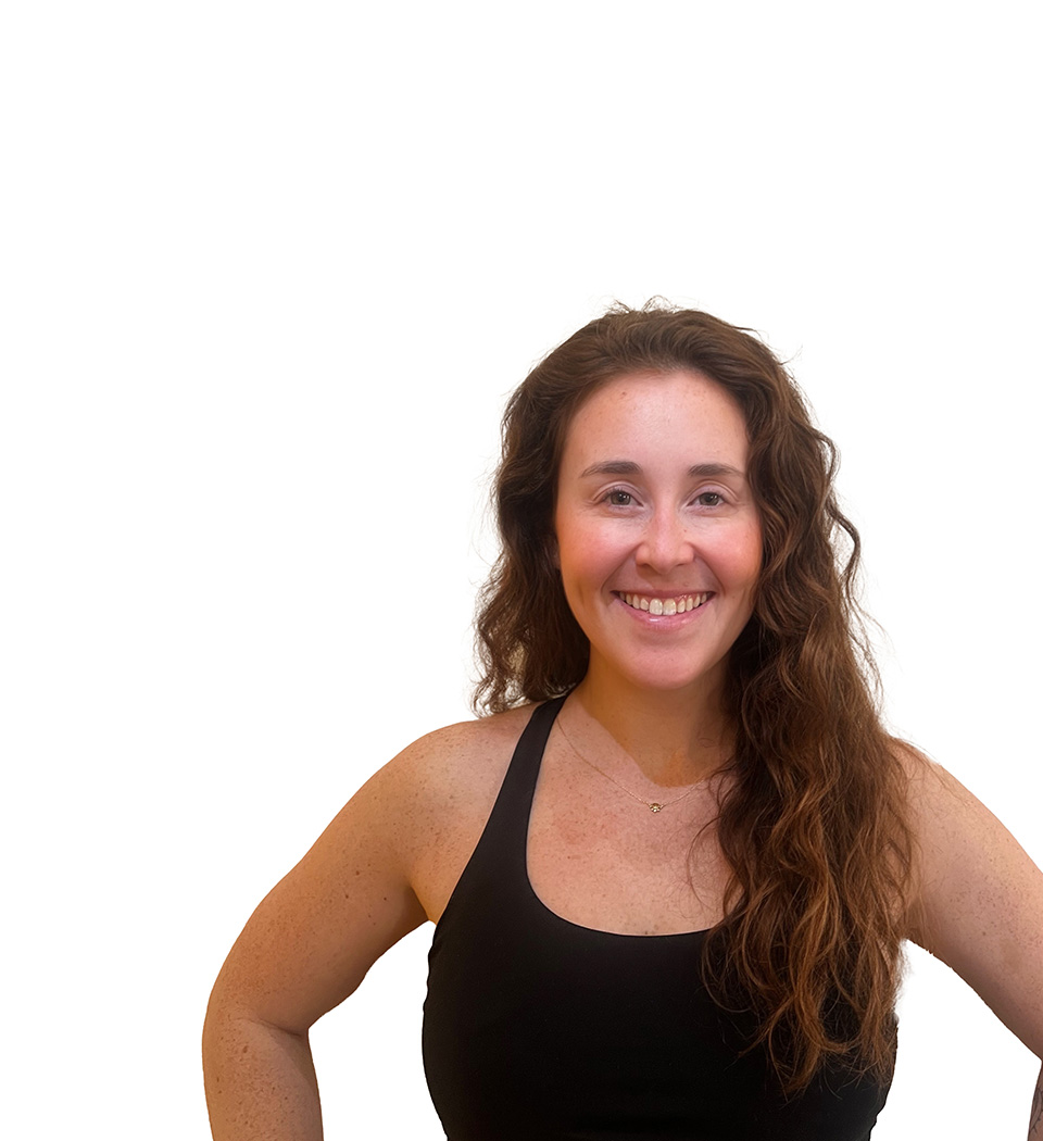 Maddy B. Barry's instructor standing confidently wearing a black top against a white background.