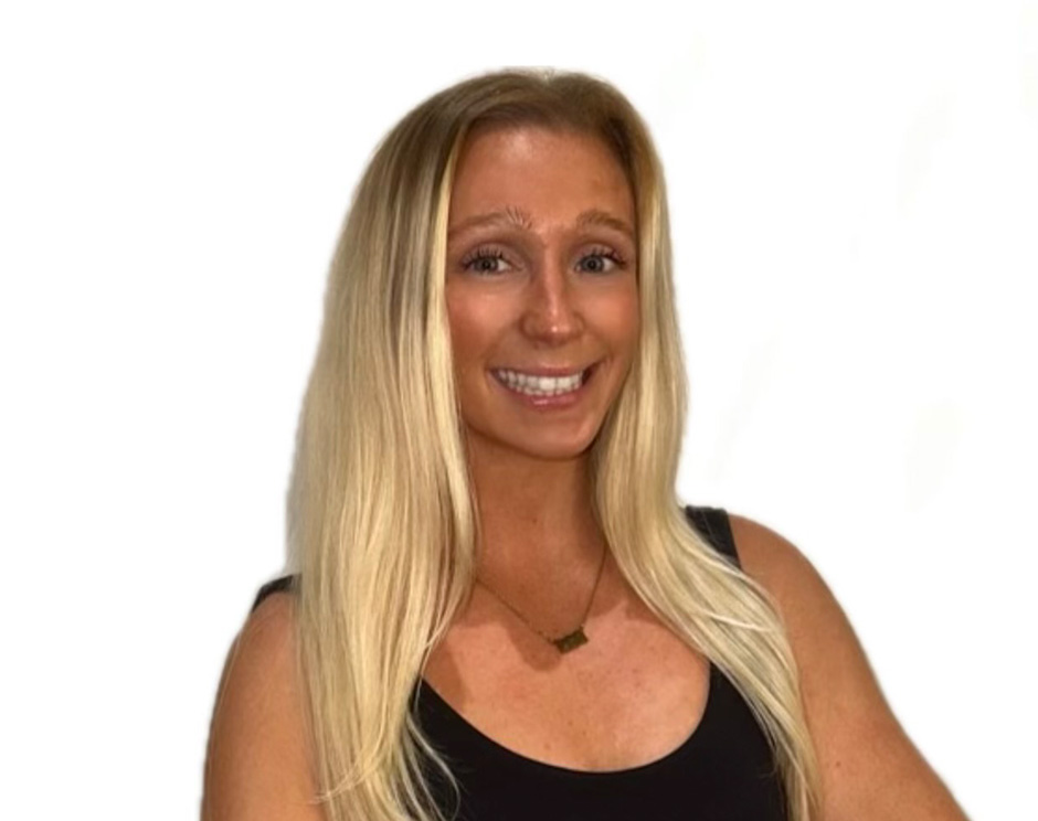 Ashling D. Barry's instructor standing confidently wearing a black top against a white background.
