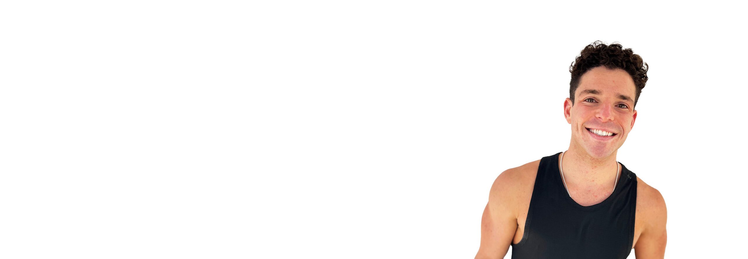 Barry's instructor standing confidently wearing a black top against a white background.