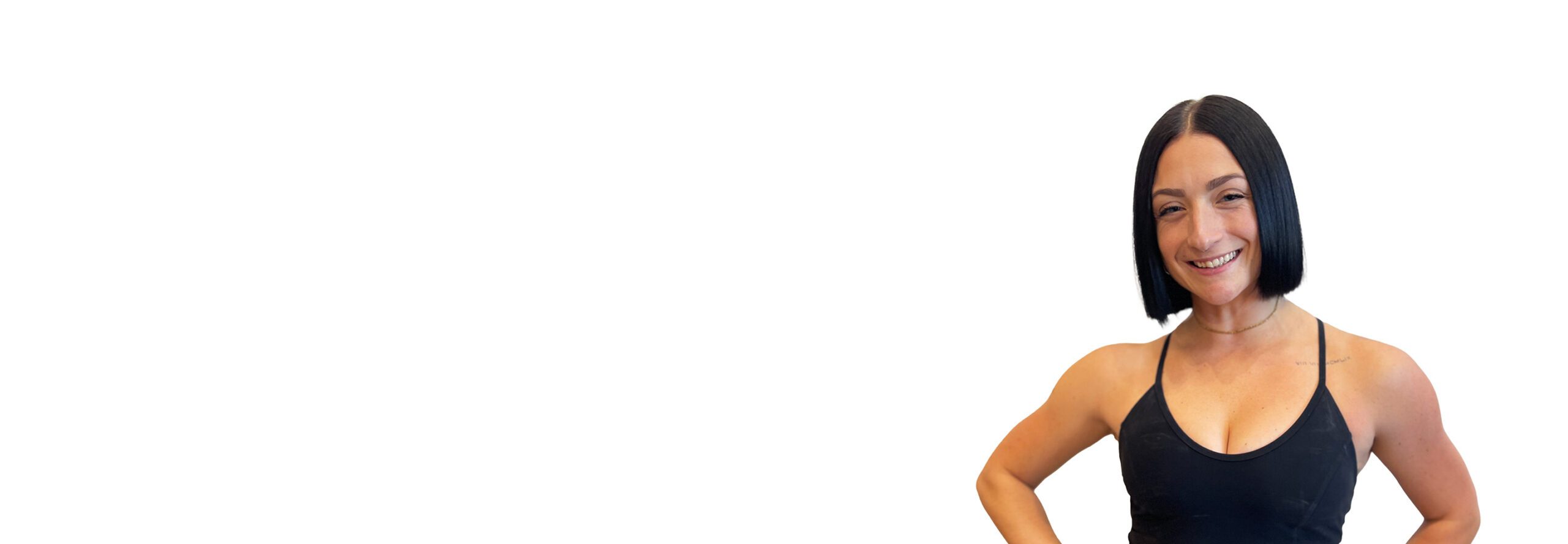 Barry's instructor standing confidently wearing a black top against a white background.