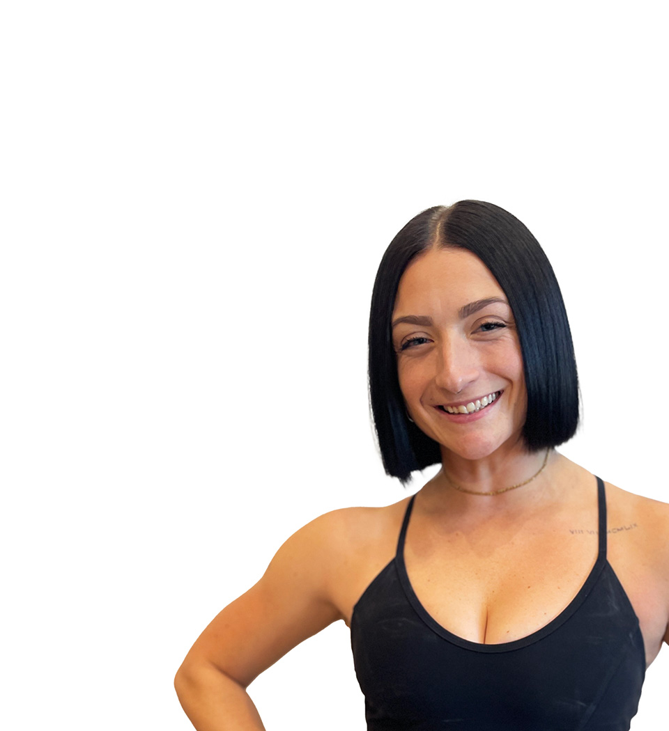 Barry's instructor standing confidently wearing a black top against a white background.