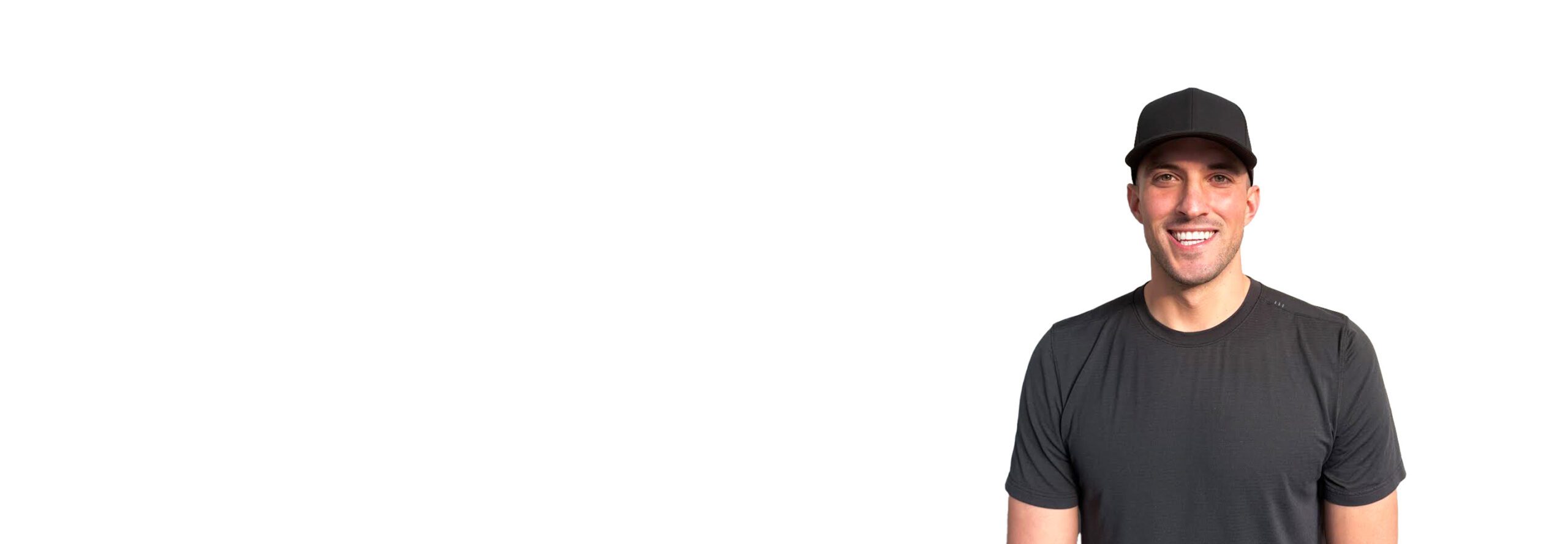 Barry's instructor standing confidently wearing a black top against a white background.